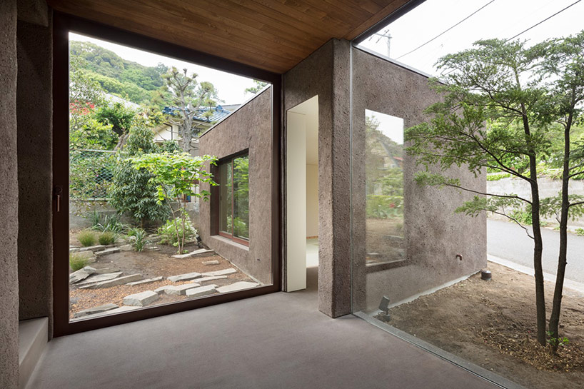 dgt creates house in oiso with timber volume on earthen foundation