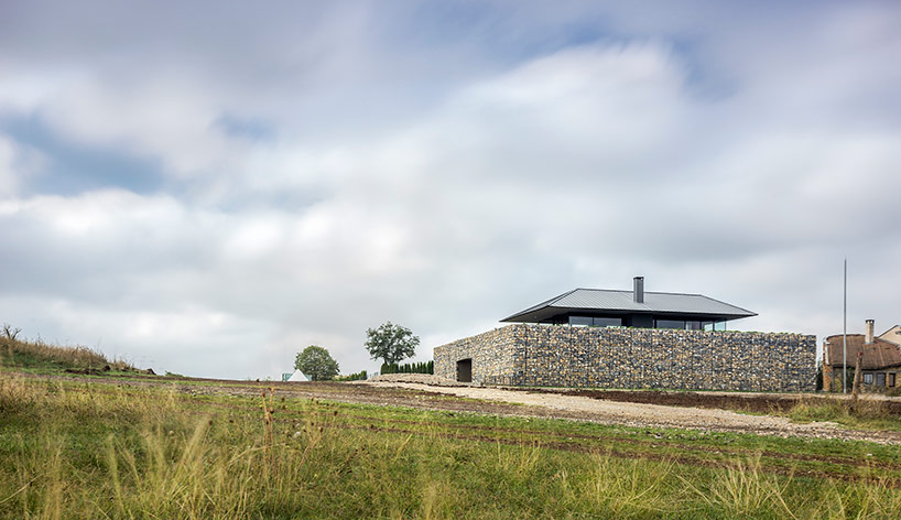 I/O architects surrounds observation house in bulgaria with gabion wall