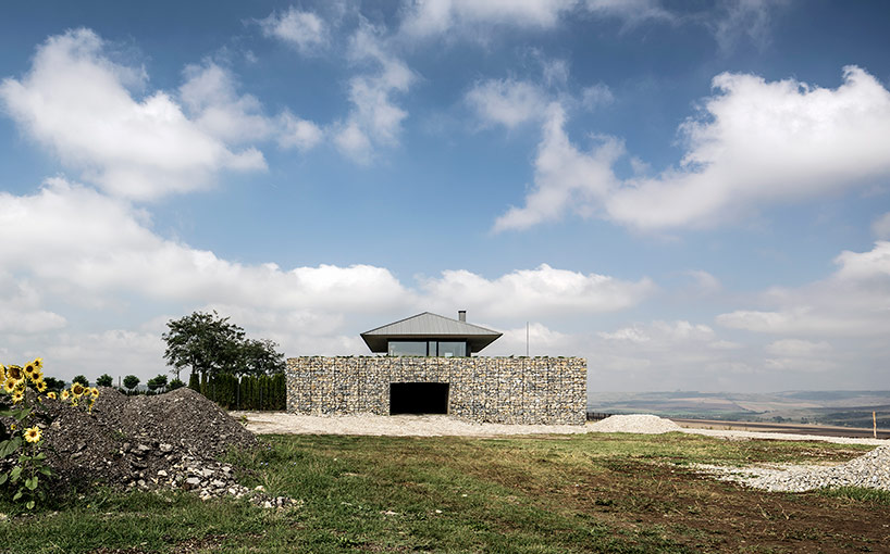 I/O architects surrounds observation house in bulgaria with gabion wall