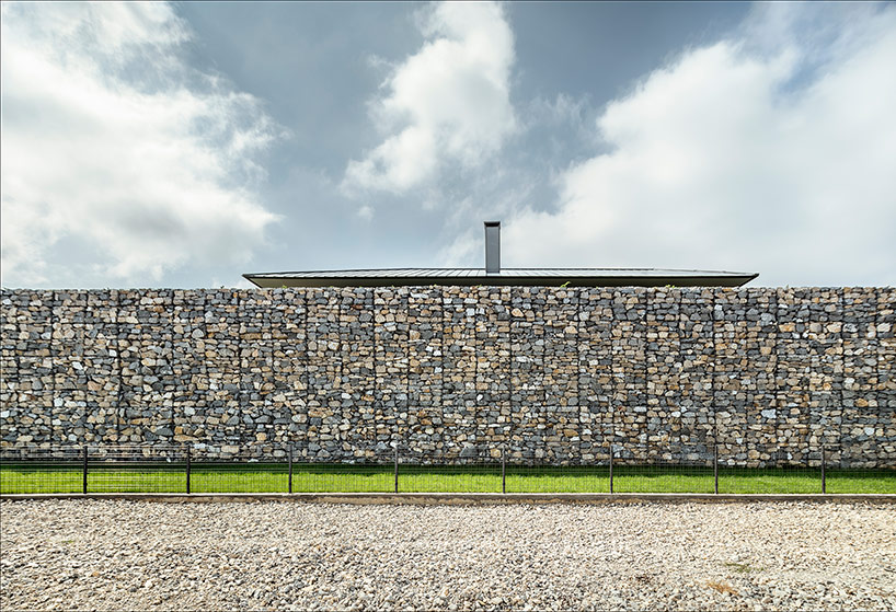 I/O architects surrounds observation house in bulgaria with gabion wall