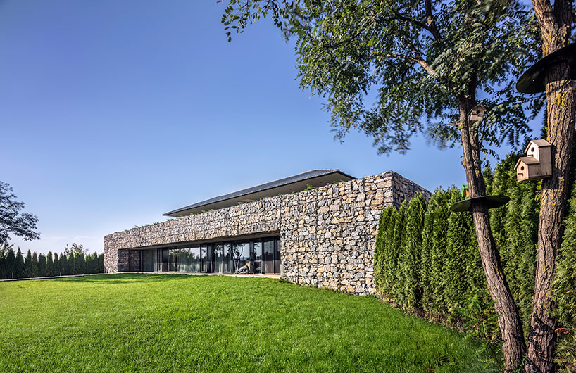 I/O architects surrounds observation house in bulgaria with gabion wall
