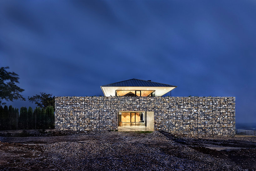 I/O architects surrounds observation house in bulgaria with gabion wall
