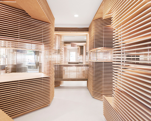 jordana maisie punctuates FEIT shoe shop in new york with layers of wood