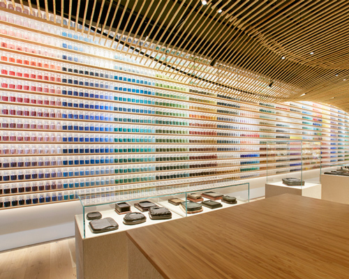 colorful hues line the walls of kengo kuma-designed pigment arts store in tokyo