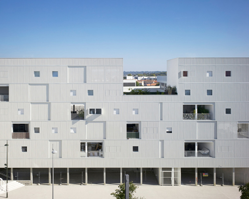 LAN architecture rhythmically inserts windows + balconies in french community housing