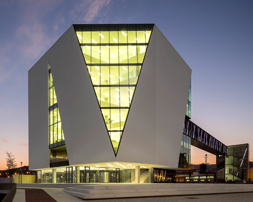 fabrica das palavras library connects city with waterfront in portugal