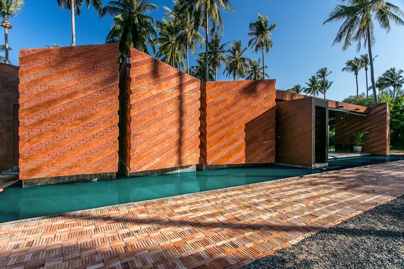 NPDA studio constructs a red brick retirement home in thailand