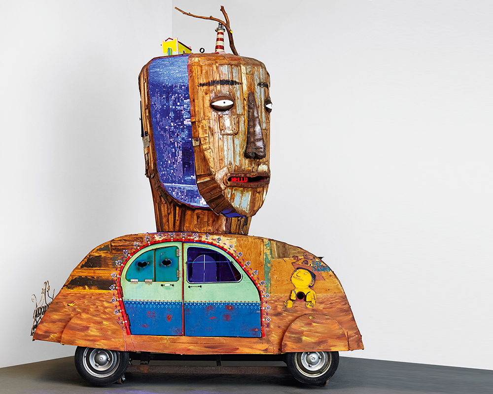 OSGEMEOS turn volkswagen beetle into a figure filled with colorful curiosities