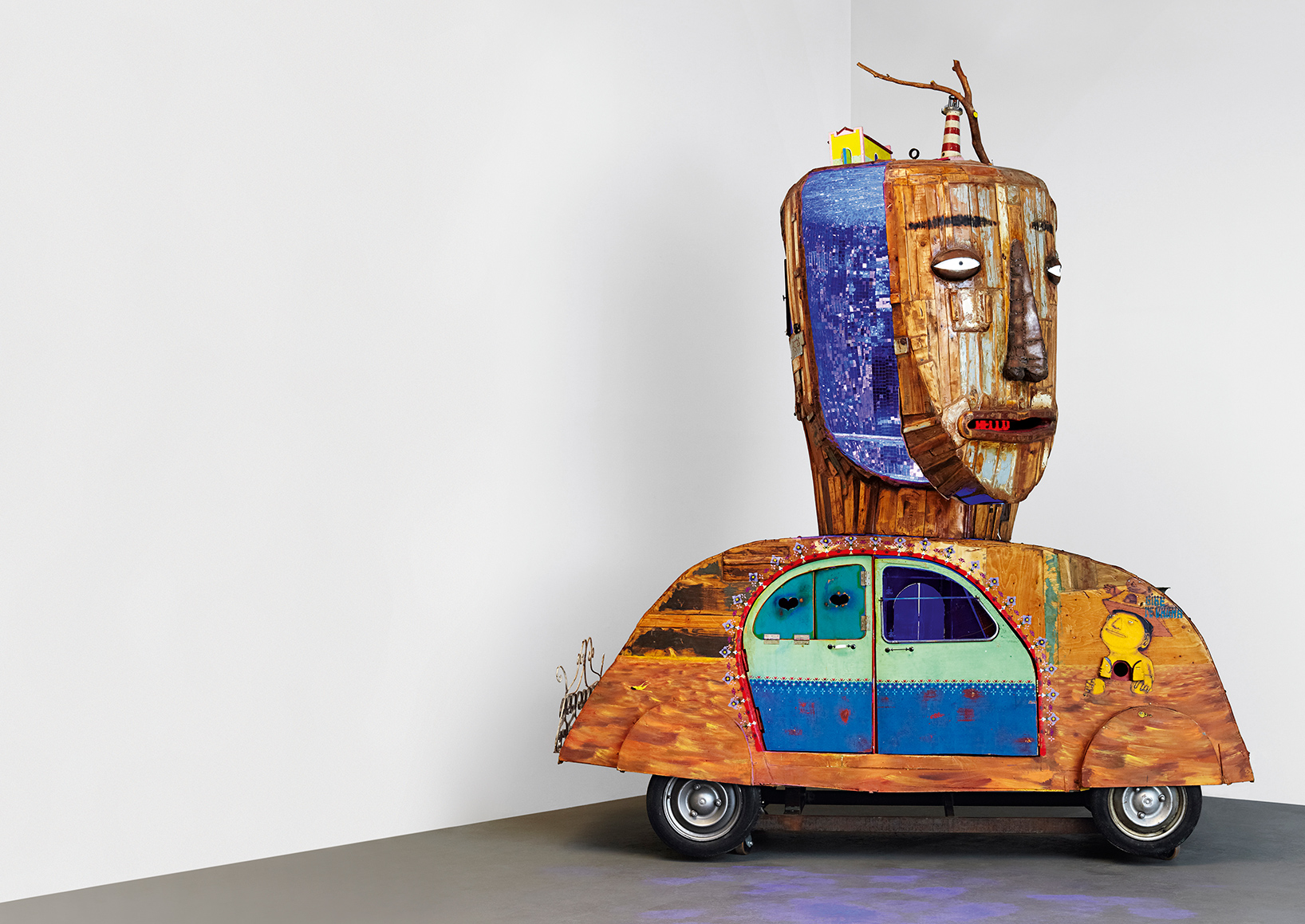 OSGEMEOS turn volkswagen beetle into a figure filled with colorful curiosities