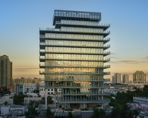 completed GLASS residential tower by rene gonzalez rises above miami beach