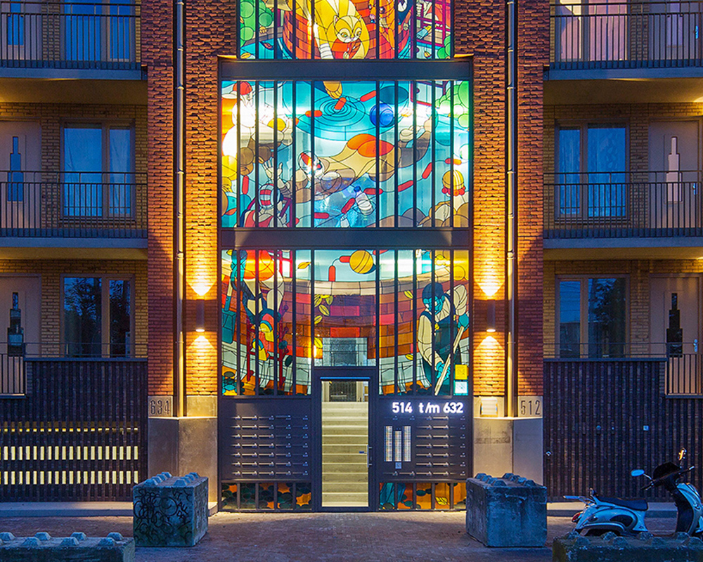stefan glerum spans stained glass façade across amsterdam housing complex