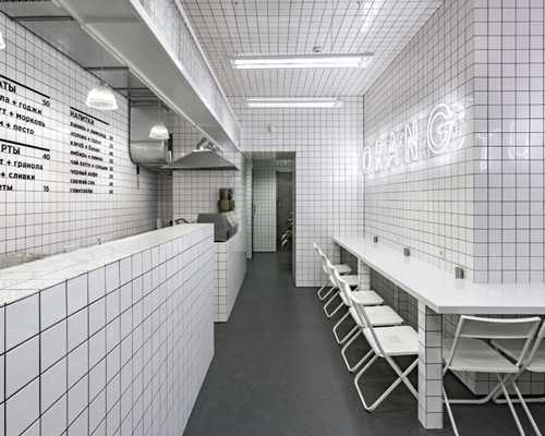 AKZ architectura wraps orang+utan veggie bar with ceramic grid tiling in kiev