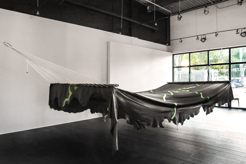 adrien missika crafts an 8-metre long leather hammock for natuzzi