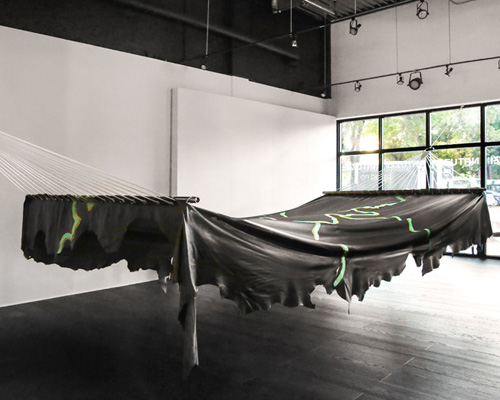 adrien missika crafts an 8-metre long leather hammock for natuzzi