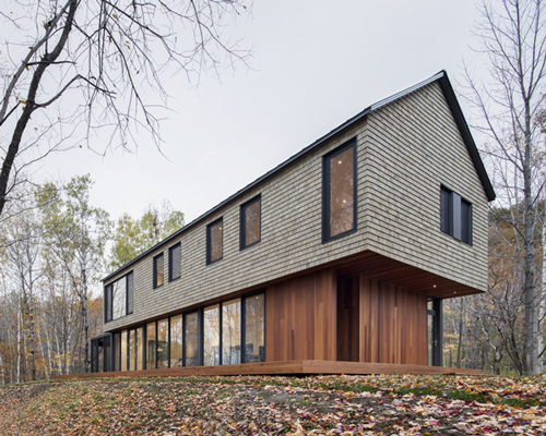 bourgeois / lechasseur wraps canadian house in the woods with cedar shingles