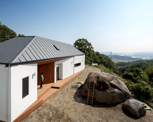 B.U.S architecture builds house around a found rock in seoul