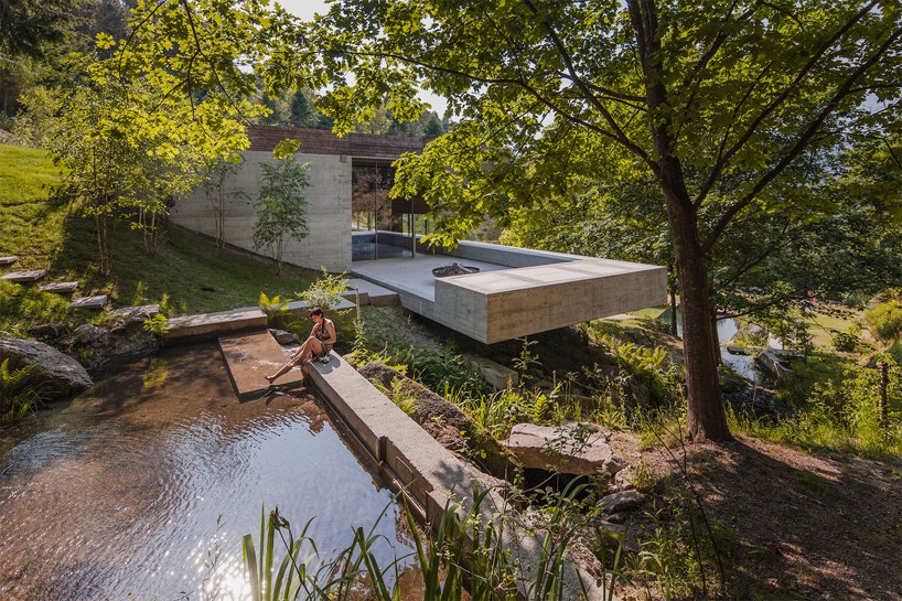 carvalho araújo's gerês house in portugal combines wooden and concrete volumes