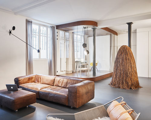 cut architectures inserts transparent volume within spacious parisian loft