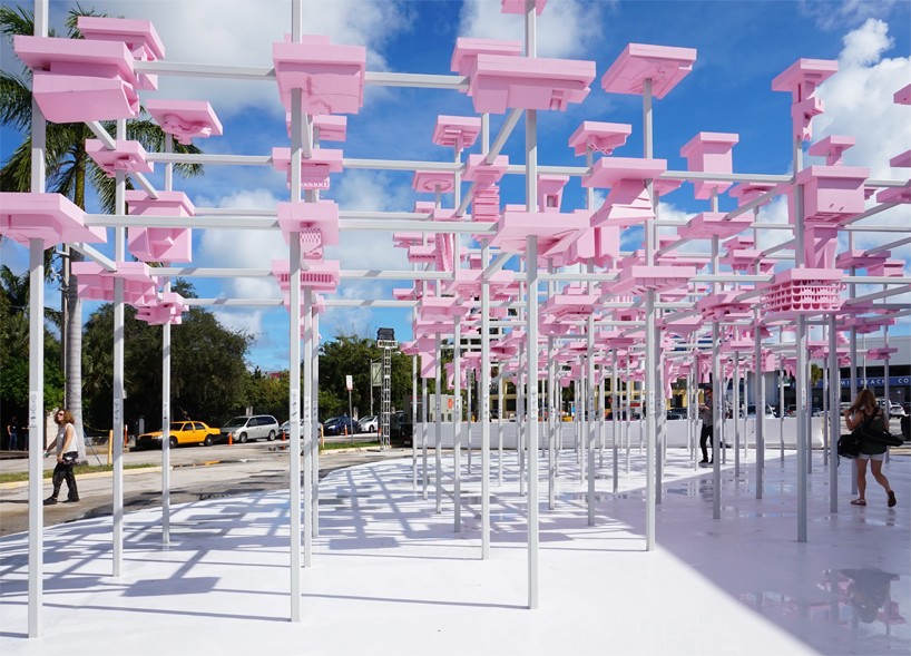 200 concept models form a pink canopy in harvard GSD's UNBUILT pavilion for design miami/