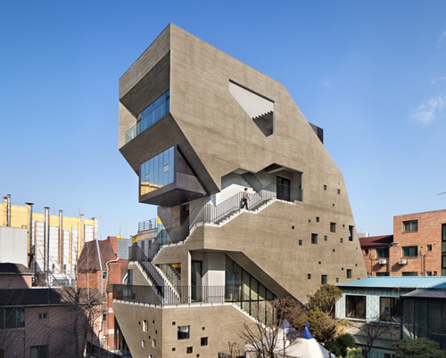 bang by min carves angular external stairway from concrete mixed-use building in seoul