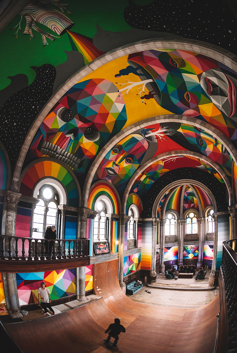 okuda san miguel paints colorful mural within converted church's indoor skate park
