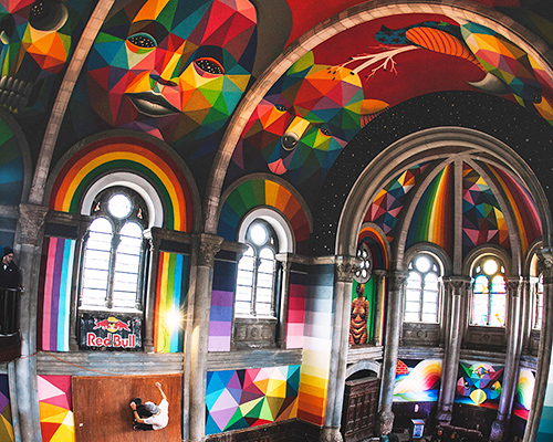 okuda san miguel paints colorful mural within converted church's indoor skate park