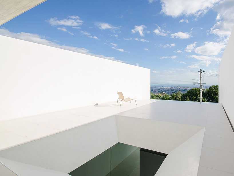 kubota architect atelier fits YA house between floating planes in japan