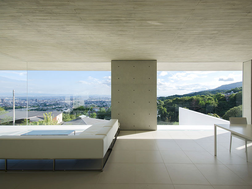 kubota architect atelier fits YA house between floating planes in japan