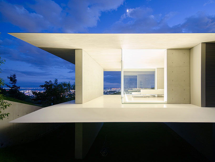 kubota architect atelier fits YA house between floating planes in japan