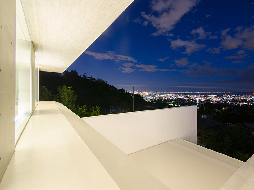 kubota architect atelier fits YA house between floating planes in japan