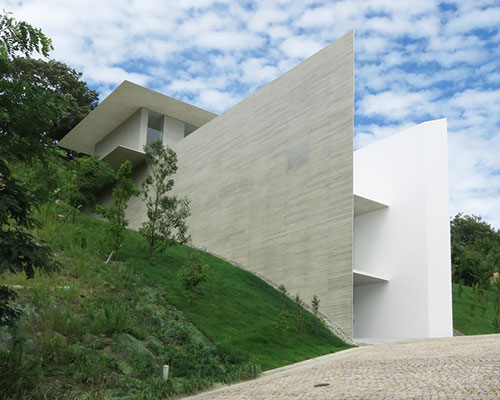 kubota architect atelier fits YA house between floating planes in japan