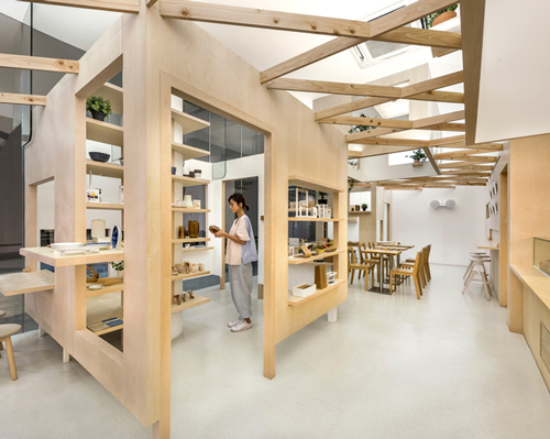 PRODUCE intersects two retail spaces with plywood planes in singapore