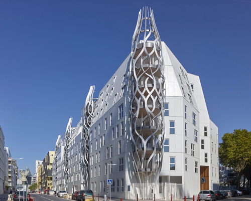 aluminum towers interweave through tetrarc's rive seine social housing in paris