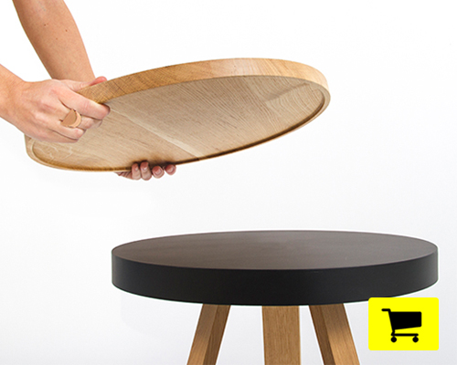 the multi-functional batea table lifts to form a serving tray