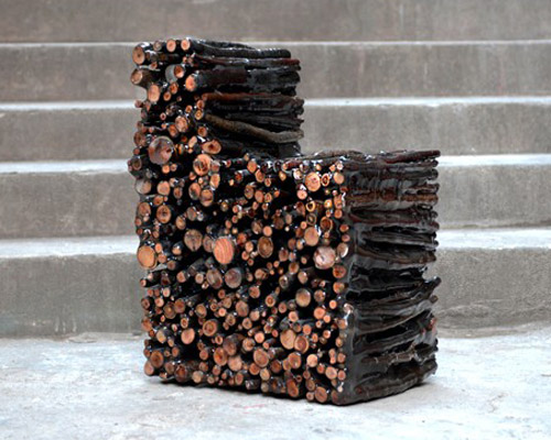 yoonki lee shapes raw chair by gluing branches with liquid epoxy