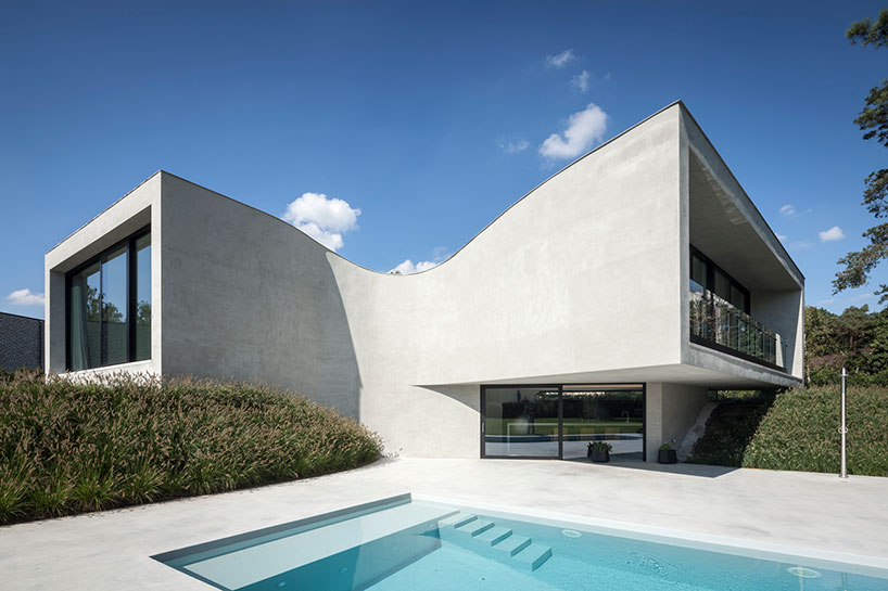 office O architects sculpts villa mq from curved concrete