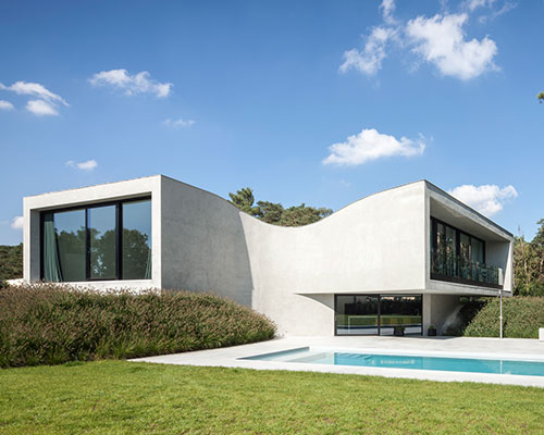 office O architects sculpts villa mq from curved concrete