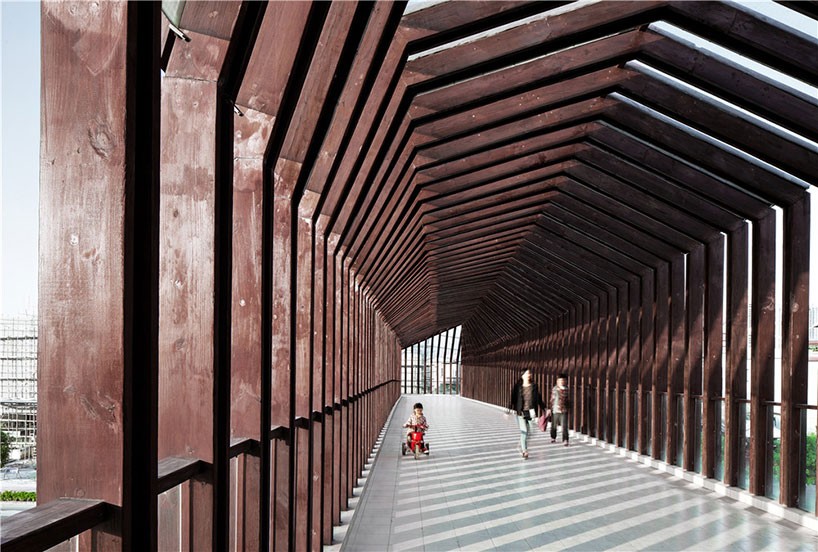 ADARC abstracts forms of houses to shape wooden footbridge in china
