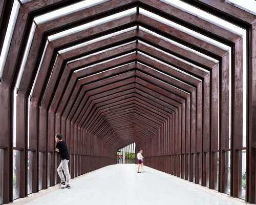 ADARC abstracts forms of houses to shape wooden footbridge in china