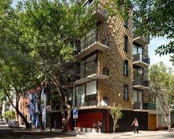 arqmov workshop clads mexico city apartment building with contrasting façades