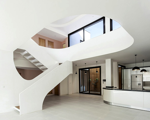 ayeneh office connects iranian house with sculptural staircase