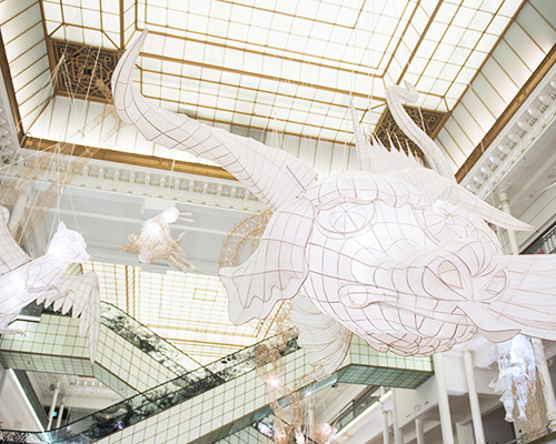 ai weiwei hangs bamboo + paper kite creatures in paris' le bon marché department store