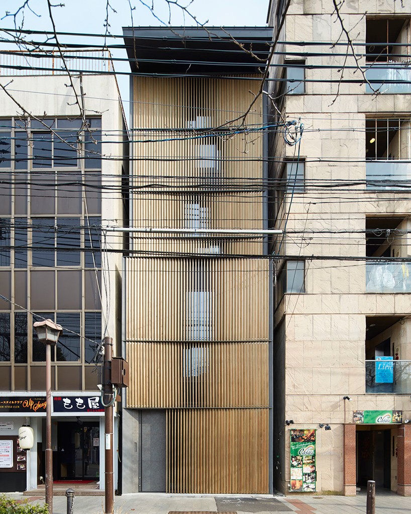 florian busch disguises eight storey nightlife venue in kyoto with louvered timber façade