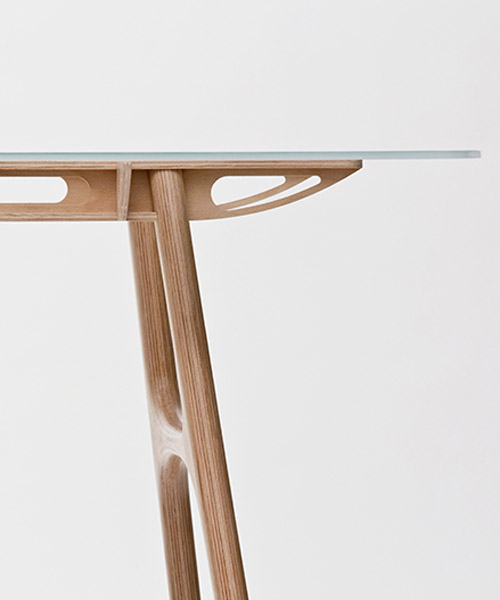 manfred table explores the sculptural structure of wooden airplane wings