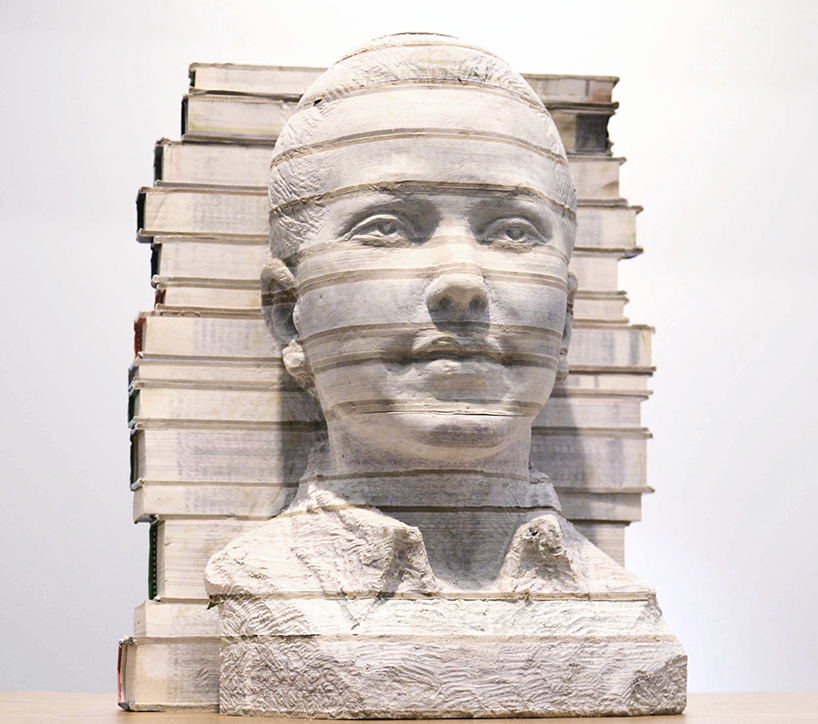 li hongbo hand carves school children from textbooks at klein sun gallery