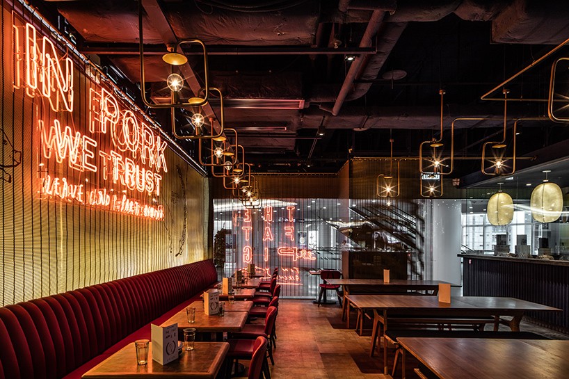 michaelis boyd employs neon detailing inside hong kong's fat pig restaurant