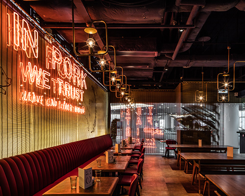 michaelis boyd employs neon detailing inside hong kong's fat pig restaurant