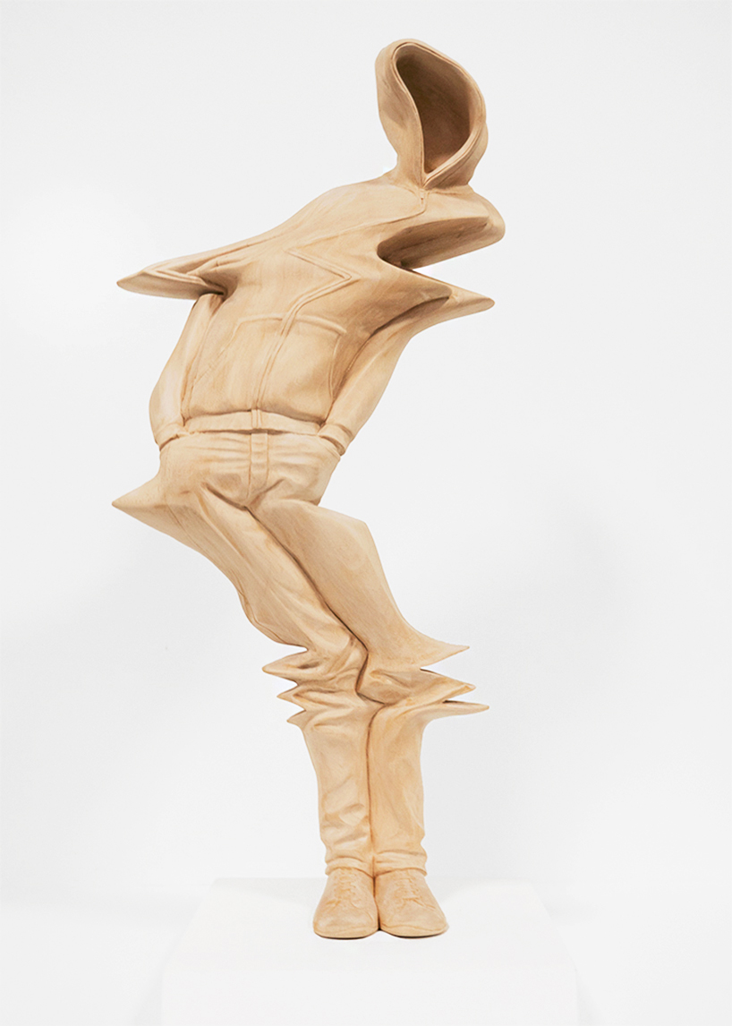 paul kaptein hand carves warped wooden figures with digital glitches