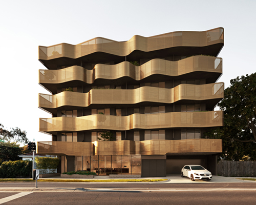 ROTHELOWMAN wraps rippling metal ribbons to melbourne apartments