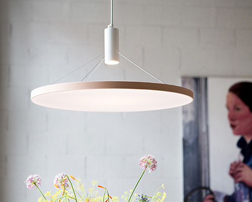 wood and fabric mingle in minimal floating light by spitsberg